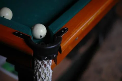 Russian billiard balls, cue, triangle, chalk on a table Green cloth Copy spac Stock Photos