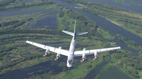 Russian bomber Tu-95 in the background of the river Stock Footage 69091376