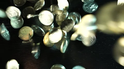 Russian coins fall from the hands on the table. Russian ruble Video stock 172982319