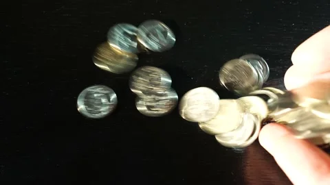 Russian coins fall from the hands on the table. Russian ruble Video stock 172986740