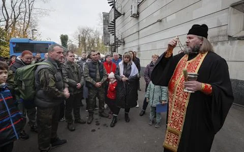 Russian conscripted men at a Moscow recruiting office during Russia's partial mi Stock Photos