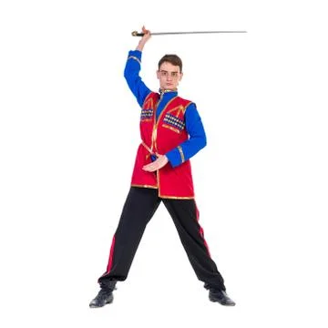 Russian cossack dance. Young dancer posing with sword Stock Photos