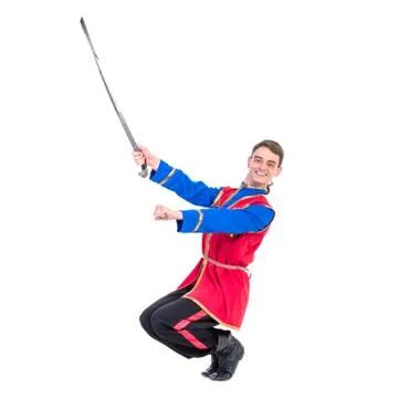 Russian cossack dance. Young dancer posing with sword Foto stock