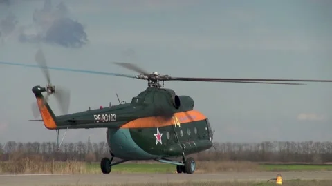 Russian DOSAAF helicopter Mi-8 (NATO: "Hip") moves towards concrete runway. Stock Footage 139807066
