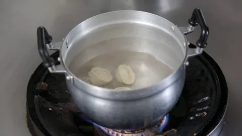 Russian Dumplings Being Put Into Boiling Pot of Water Stock Footage 76208015