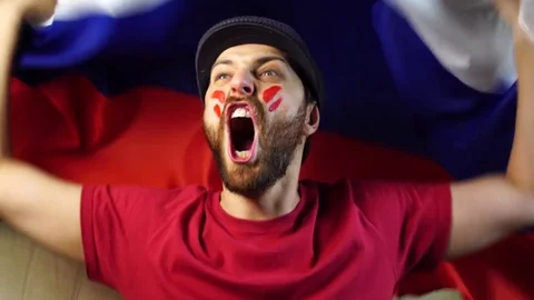 Russian fan holding the national flag Stock Footage