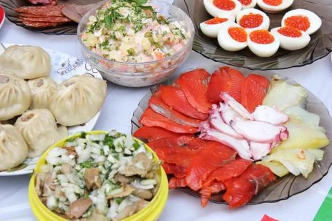 Russian Festive table with seafood and salmon caviar. Stock Photos