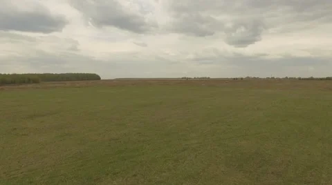 Russian field in spring Grey sky Aerial shot Stock Footage 69069195