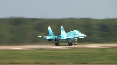Russian fighter-bomber Su-34 accelerates on concrete runway and takes off. Stock Footage 107132939
