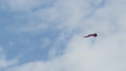 A Russian fighter plane painted blue and red flies in the sky Stock Footage 226597394