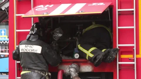 Russian firemen at the fire truck Stock Footage 220930262
