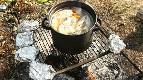 Russian fish soup on fire 2 Stock Footage 11434798