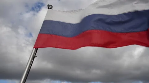 Russian flag against cloudy sky Stock Footage 261729753