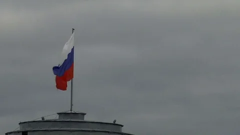 Russian flag against the gray sky Stock Footage 80717544