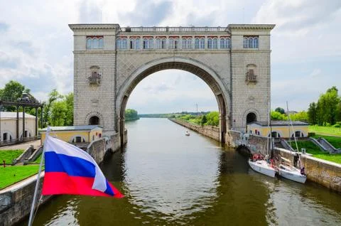 Russian flag on background of arch of navigation lock, Uglich Stock Photos