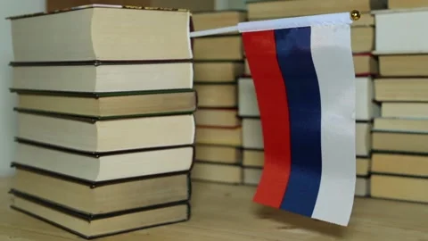 Russian flag on the background of books. Flag of Russia and paper books. Stock Footage 86282202