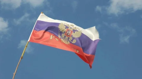 Russian flag on a bamboo flagpole against the sky Stock Footage 108560894