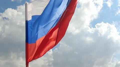 Russian flag develops in the wind high in the mountains, , close-up. 스톡 동영상 163290680
