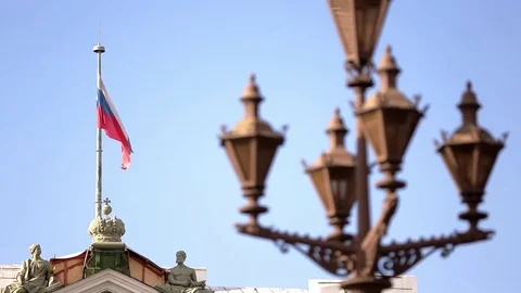 Russian flag flutters in the wind on the flagpole on blue sky background Stock Footage 72374622