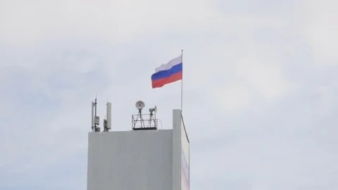 Russian flag flutters in the wind on the flagpole on blue sky background. R.. Stock Footage 75235077