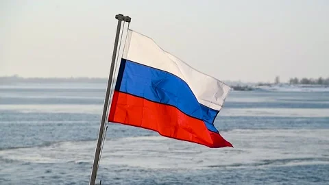 The Russian flag is flying against the blue sky Stock Footage 321242008