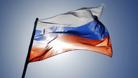 Russian flag flying in slow motion and back lit by the sun. Stock Footage 89794026