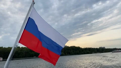 The Russian flag is flying in the wind from a ship on the river. Stock Footage 160126651