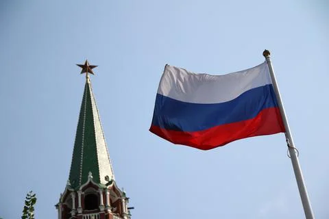The Russian flag with the Kremlin on the back Stock Photos