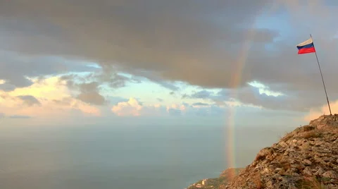 Russian flag on the top of a mountain on the background of the sea Stock Footage 41831777