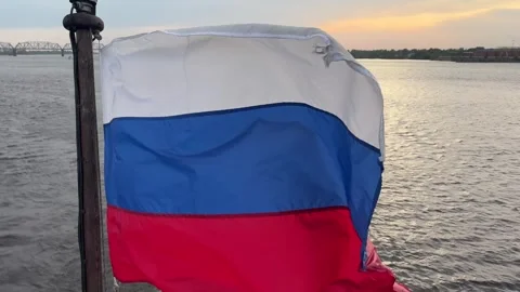Russian flag waves at the stern of a ship sailing calmly, symbolizing nationa Stock Footage 310613015