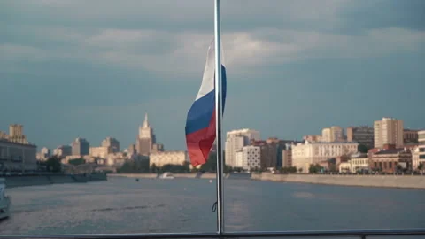 Russian flag waving in the background of the cityscape, slowmotion Stock Footage 212389636