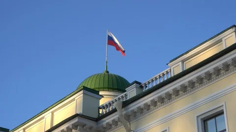 Russian flag winds in the historic building of St. Petersburg Stock Footage 128679221