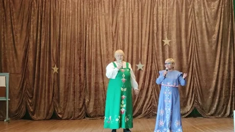 The Russian folk ensemble performs on the stage of the village house of culture. Stock Footage 173584504