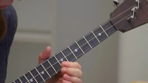 Russian folk instrument, balalaika, string instrument, close-up. Man playing Stock Footage 166385523