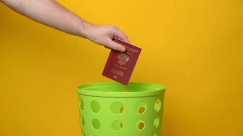 Russian foreign passport is thrown into the bin Stock Footage 194566371