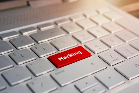 Russian hacker hacking the server. Color button on the gray silver keyboard o 스톡 사진
