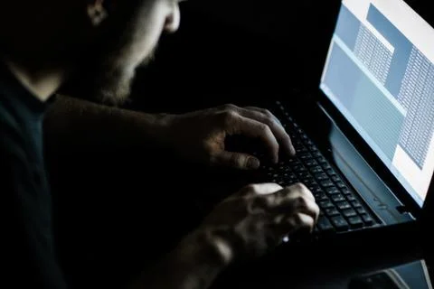 Russian hacker hacking the server in the dark 스톡 사진