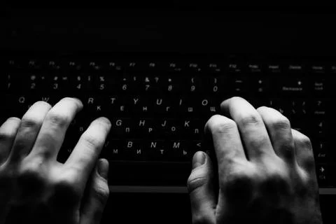 Russian hacker hacking the server in the dark Фото