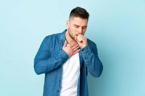 Russian handsome man isolated on blue background coughing a lot Stock Photos