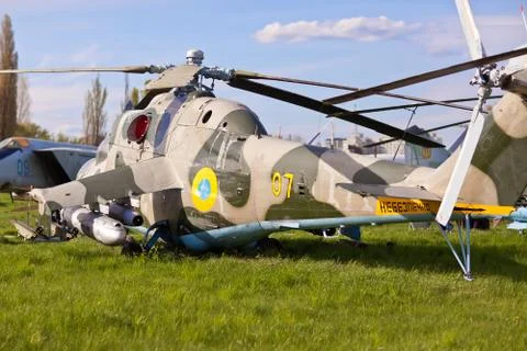 Russian helicopter standing on the grass with the engine OFF Stock Photos