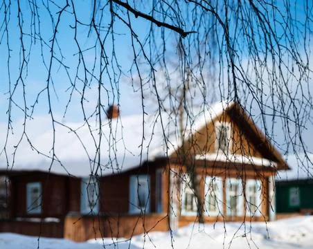 Russian house through tree branches backdrop Foto stock