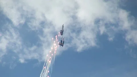 "Russian Knights" on 4 Su-27 aircraft perform aerobatics. Stock Footage 147725434