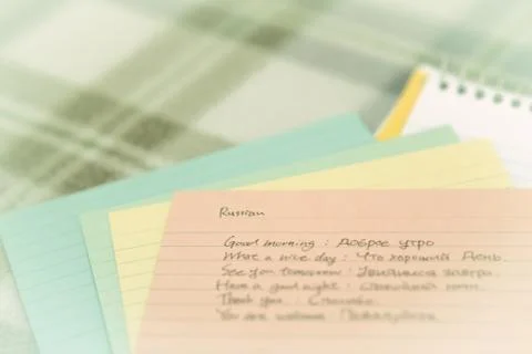 Russian; Learning New Language Writing Greetings on the Notebook Stock Photos