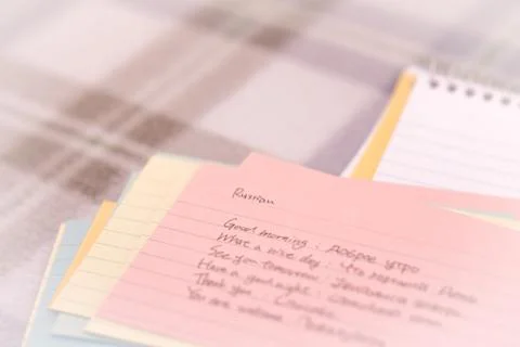Russian; Learning New Language Writing Greetings on the Notebook Stock Photos