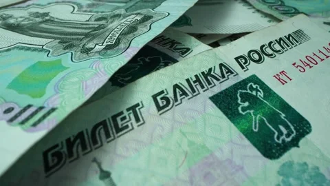 Russian money macro. into a large bundle lying on the table. Fingers counting Stock Footage 264112575