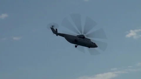 Russian multi-purpose transport helicopter Mi-26 performs left turn with climb Video stock 107584427