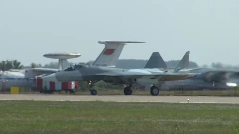 Russian multifunctional fighter Su-57 (NATO - Felon) is taxiing on  runway. Video stock 219808965