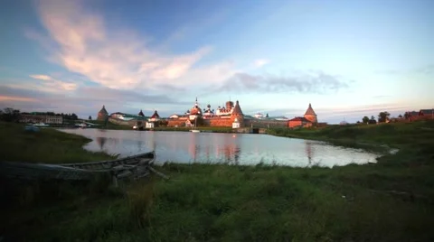 Russian Orthodox Solovetsky Monastery and old wooden boat. Stock Footage 64929743