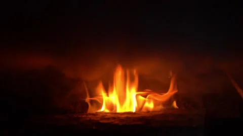 Russian oven, a fire in the fireplace Stockbeeldmateriaal 250549093
