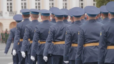 Russian Police Marching in Sync From Behind Slow Motion Hands Waving Stock Footage 113403945